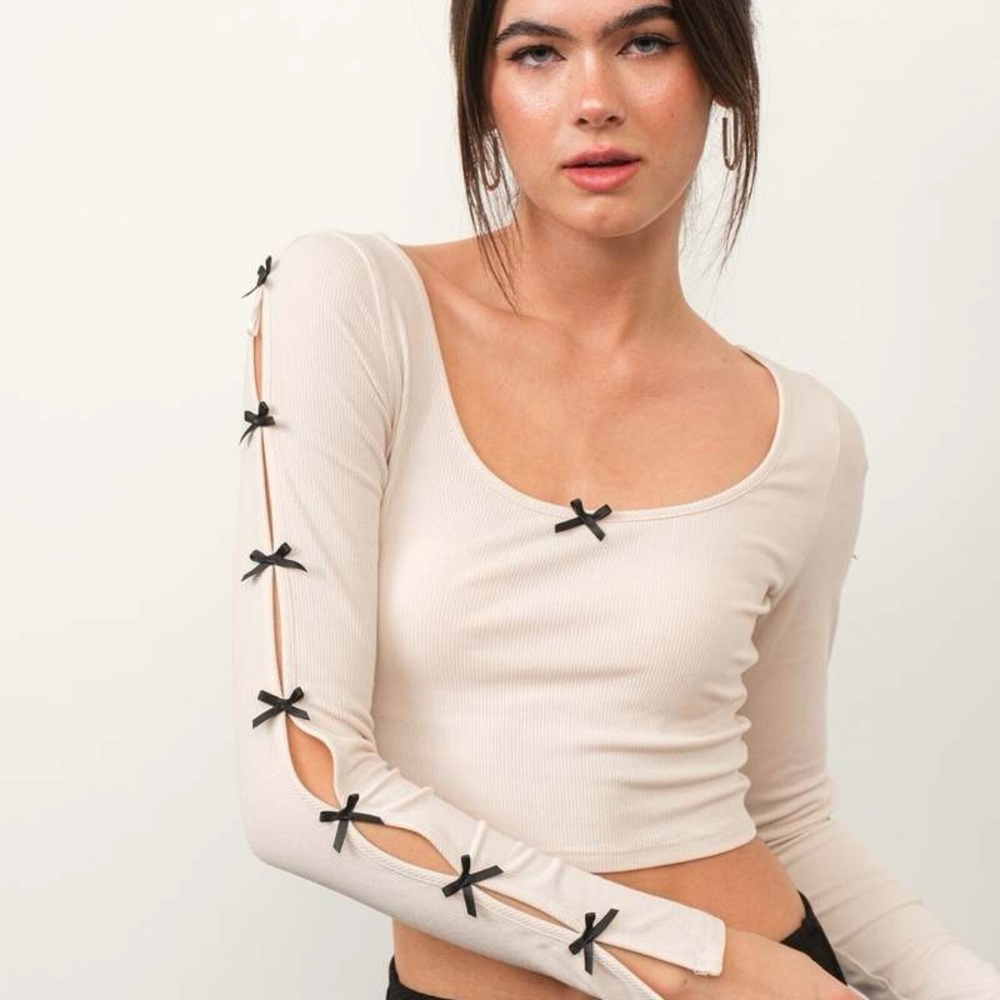 Trendy Beige Long Sleeve Top with Black Accents